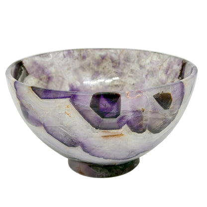 Amethyst crystal bowl on a white background